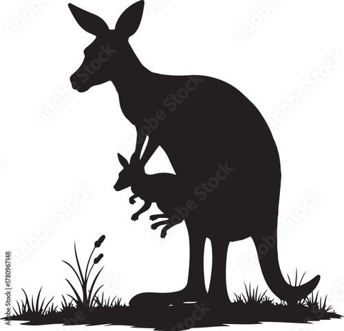 Black silhouette of mother kangaroo with joey in pouch on grassy ground