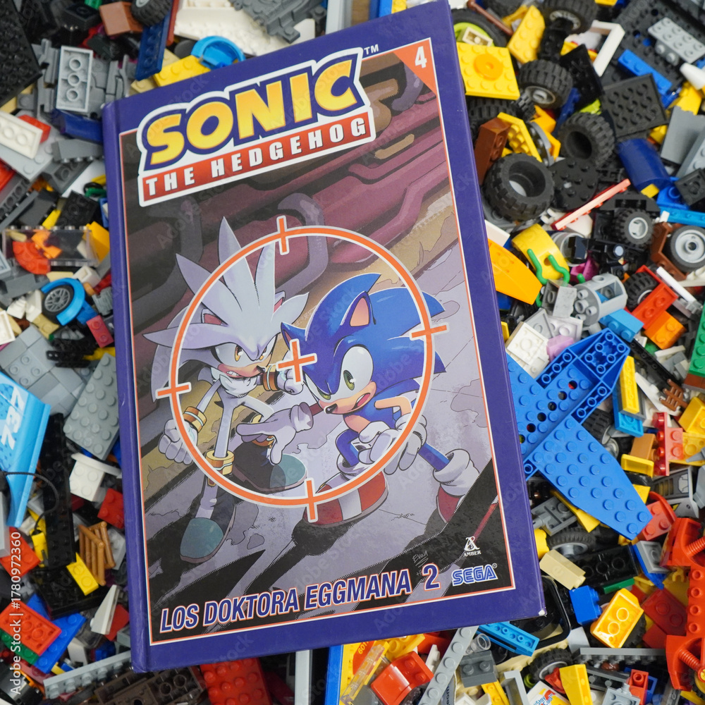 Fototapeta premium Sonic the Hedgehog comic book with Silver and Sonic characters, surrounded by colorful toy bricks