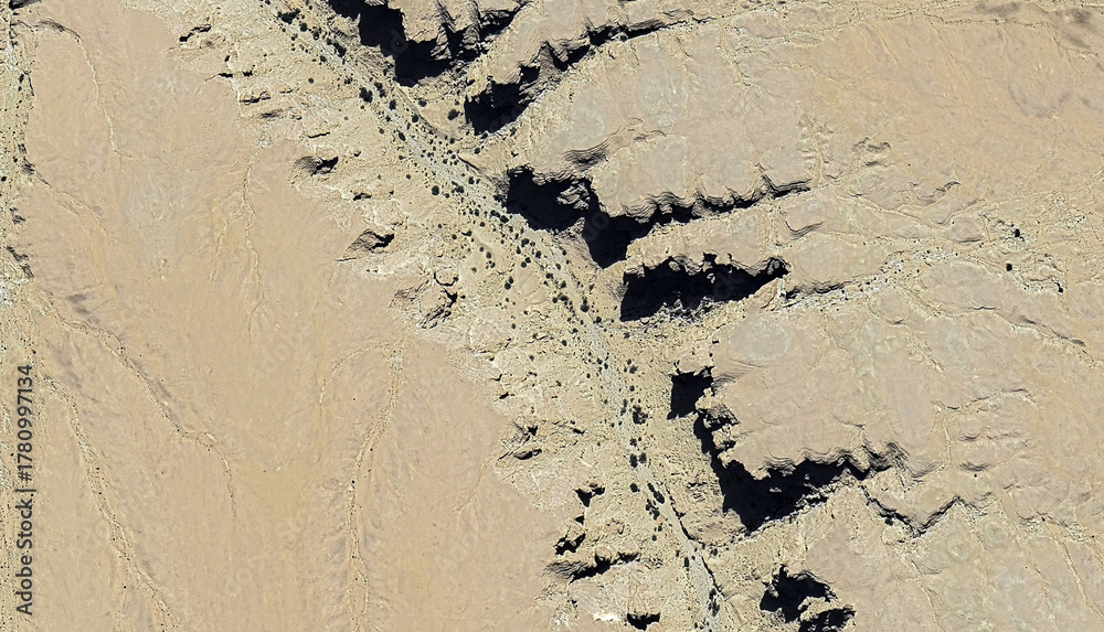 Fototapeta premium Golden Expanse: Aerial View of Pristine Desert Landscapes Near Yanbu al Bahr, Saudi Arabia