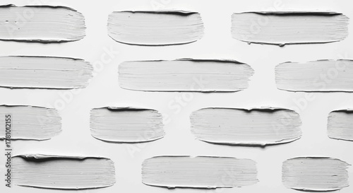 Abstract monochrome texture featuring numerous horizontal white paint strokes with rough edges, creating a minimalist and artistic background for creative projects and design concepts