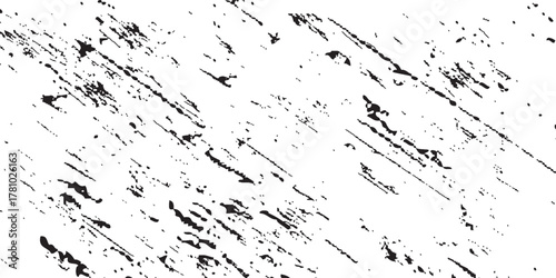 Distressed black and white grunge texture overlay with diagonal scratches and speckles.