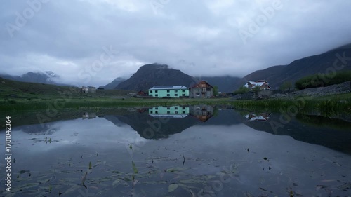 Reflection of house with tiger hills in backdrop, Drass, India 