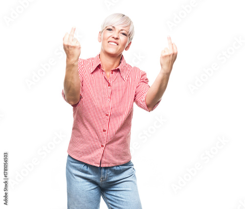 Adult woman showing fuck off gesture, isolated on white background. Female person with obscene gesture giving the middle finger and looking to camera.