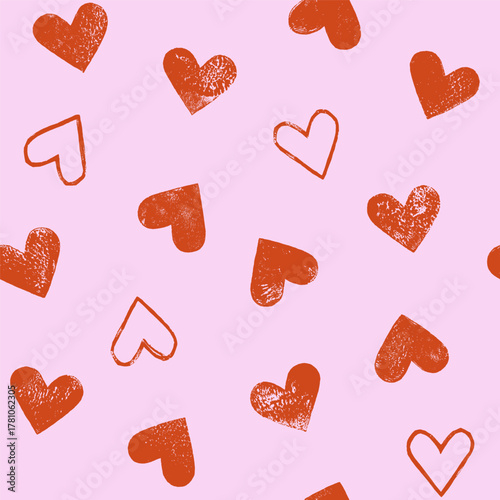 Linocut hearts seamless repeat vector pattern. Hand printed grunge relief printing textured aged distressed heart shapes endless Valentine's day background. Craft handmade wrapping paper template