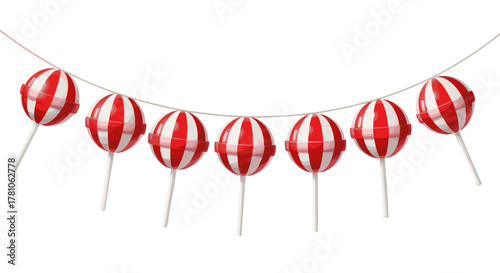 Red and white striped lollipops hanging on a string for decoration  