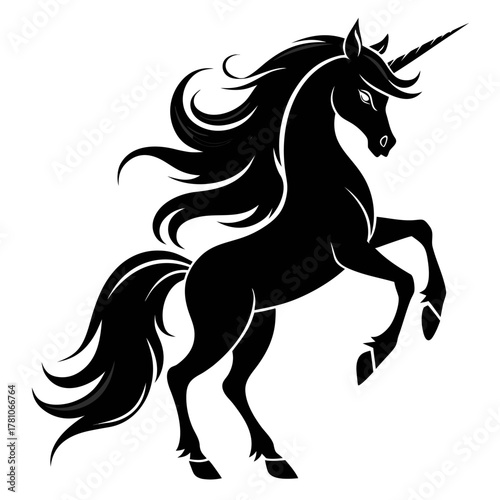 Majestic black unicorn rearing upward with flowing mane and tail
