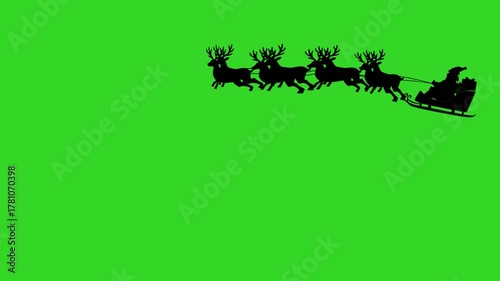 Santa Claus pulled by reindeer silhouette on green screen