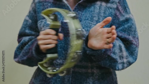 plaid shirt adds warm ambiance, music scene enriched by rhythmic tambourine and plaid shirt style