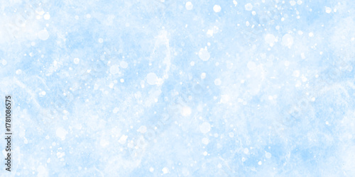 Abstract blue grunge background with bokeh effect snowflakes texture. Soft sky-blue paint aquarelle hand-painted watercolor background design. beautiful bright blue paper texture. 