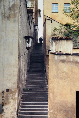 narrow street of steps between buildings in old town Prague