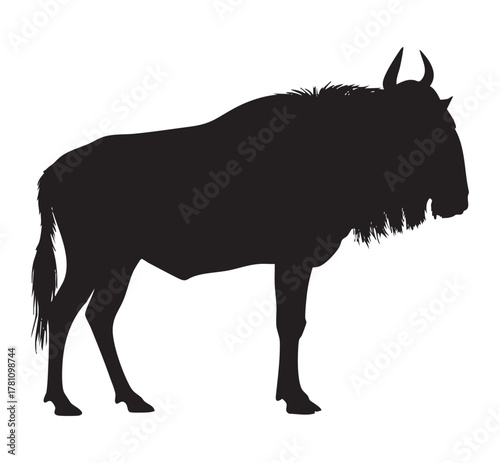 Silhouette of a wildebeest standing against a white background