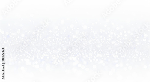 Abstract shimmering silver glitter background with bokeh effect and soft focus