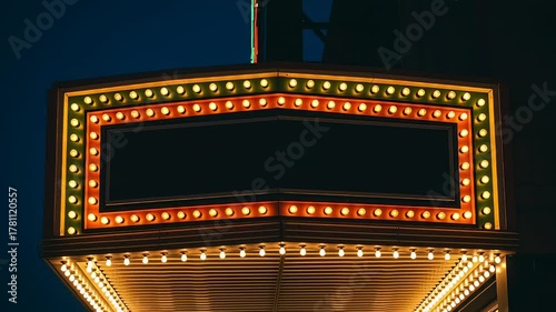 Blank Retro Theater Marquee Sign with Glowing Lights at Night.