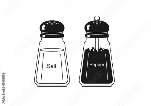 Salt and pepper shakers with labeled contents sit sidebyside