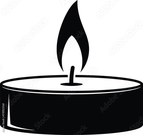 Black silhouette of a burning tea light candle icon, minimalist graphic design element