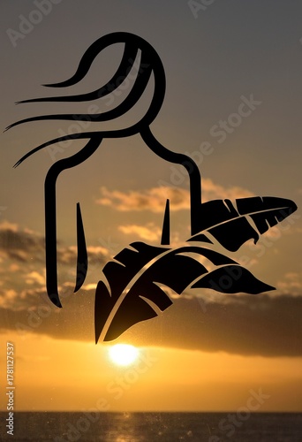 Silhouette of a woman at sunset