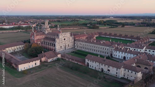 Certosa di Pavia aerial view at sunset Gra-Car (Gratiarum Carthusia, Monastery of Santa Maria delle Grazie - Sec. XIV),Pavia, Italy.