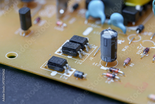 Exploring the intricate landscape of a printed circuit board with miniature electronic components and copper traces