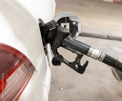 Man Refueling a Car at Gas Station