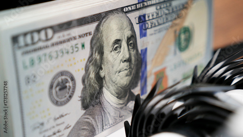 100 Dollar Bills in Money Counting Machine