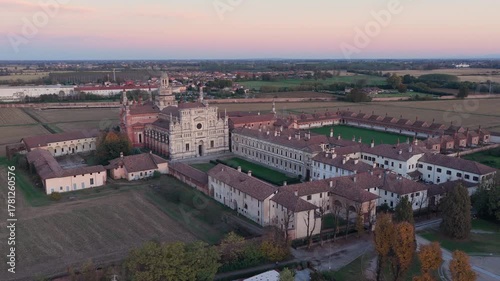 Certosa di Pavia aerial view at sunset Gra-Car (Gratiarum Carthusia, Monastery of Santa Maria delle Grazie - Sec. XIV),Pavia, Italy.