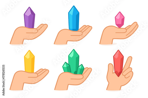 Hands holding various colorful faceted crystals and natural healing gemstones
