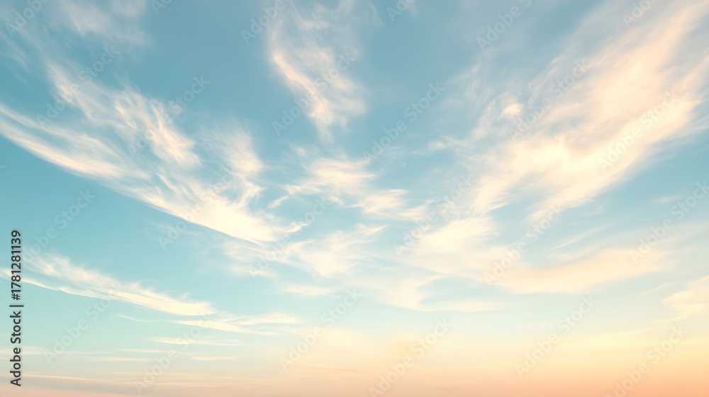 Fototapeta premium A picturesque view of soft clouds floating in a clear blue sky, showcasing natural beauty and serene atmosphere.