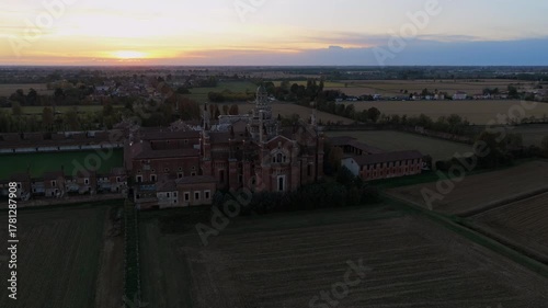 Certosa di Pavia aerial view at sunset Gra-Car (Gratiarum Carthusia, Monastery of Santa Maria delle Grazie - Sec. XIV),Pavia, Italy.