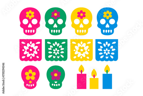 Brightly colored sugar skulls, traditional papel picado banners, and burning candles for Day of the Dead celebration