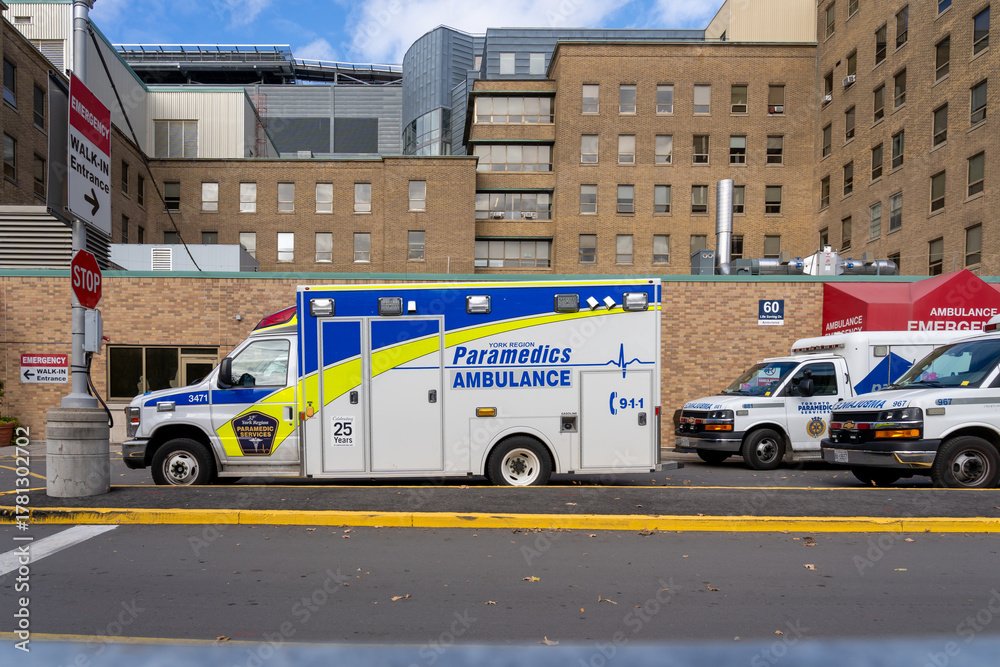 Fototapeta premium Toronto, Canada - November 6, 2025: A City of Toronto Paramedic Services ambulance car is seen in Toronto.TPS is the statutory emergency medical services provider.