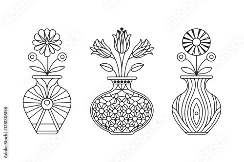 Three decorative vases with floral arrangements in black and white