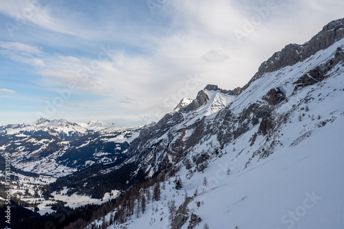 Winter Landscape of Snow-Covered Mountains and Alpine Valley. Les Diablerets Region, Swiss Alps, Switzerland