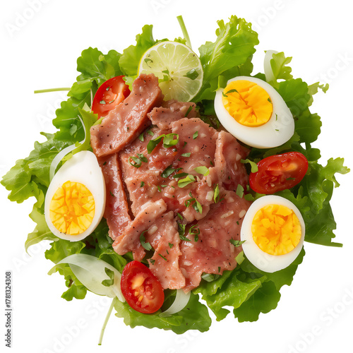 Delicious Salad With Sliced Meat, Boiled Eggs, and Fresh Vegetables Served in...