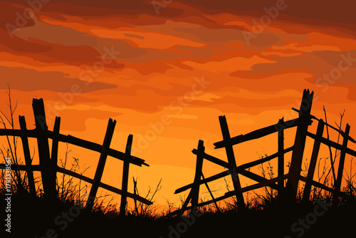 Silhouette of a broken wooden fence surrounded by grass against a vibrant orange sunset sky with scattered clouds.