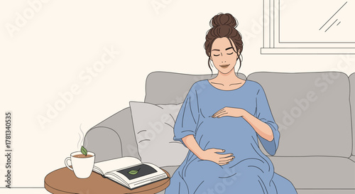 Pregnant caucasian female in a blue dress seated on a gray couch, gently cradling her belly, beside a table with a steaming cup and an open book.