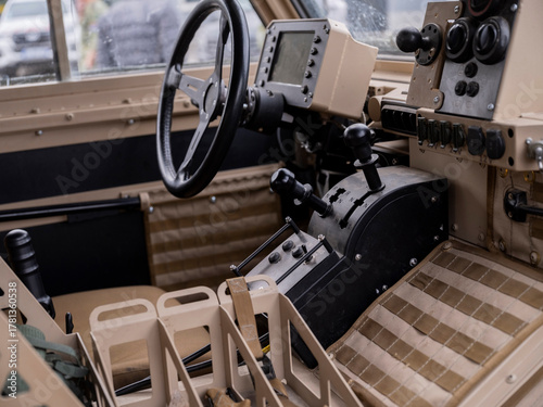 Konstfotografi Close view of armored vehicle interior with steering controls instrumentation an