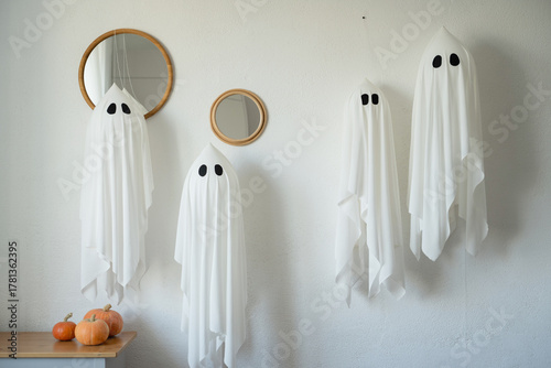 Halloween ghostly decorations with pumpkins
