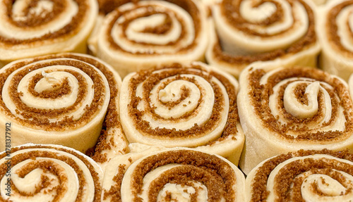 A Tray Filled with Unbaked Raw Cinnamon Rolls Ready to be Baked in the Oven