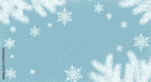 Winter background with snowflakes and pine branches on light blue
