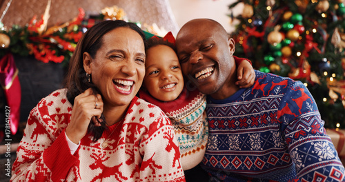 Fotografie Laughing, family and selfie for Christmas, home and bonding on December holiday, happy and together