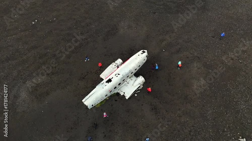 4k aerial video of Wreckage of DC plane on black sand beach in Iceland a popular tourist spot