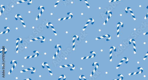 Candy cane seamless pattern. Blue and white striped candy canes pattern. Season greetings wallpaper. New year background