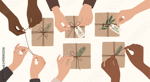 Diverse hands wrapping and decorating brown paper christmas gifts with pine sprigs and tags