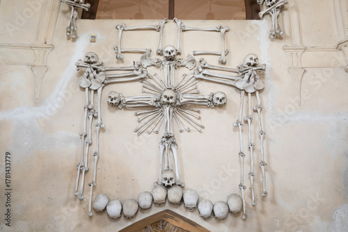 Cross made out of human skulls and bones at Sedlec Ossuary, a 14th-century Roman Catholic chapel, located beneath the Cemetery Church of All Saints, part of the former Sedlec Abbey.
