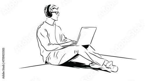 Man Sitting on Laptop with Headphones on Head