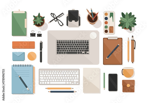 Workspace seen from above with laptop keyboards and various office supplies spread out