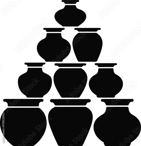 Stacked pottery jars arranged in a pyramid silhouette display