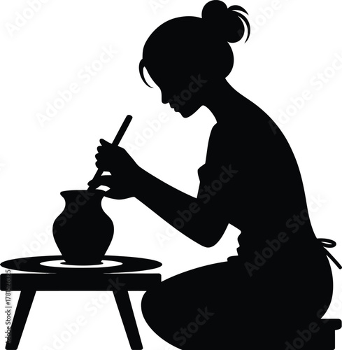 Woman artist silhouette shaping clay on a pottery wheel