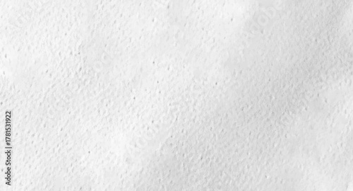 The white paper surface with its clear texture reveals subtle shadows and delicate texture patterns.