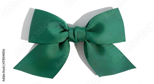 A beautiful emerald green satin bow with two loops and two tails, isolated on a white background.